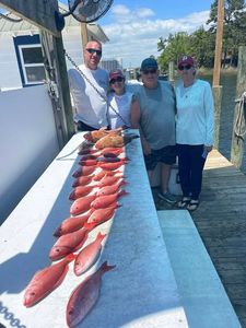 Fresh caught red snapper displayed on fishing boat deck in Niceville FL