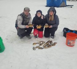 Three people enjoying a fishing trip in Mosinee