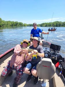 Three people fishing in Mosinee