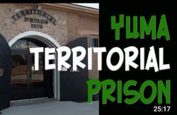 Yuma Territorial Prison museum entrance with stone archway and wooden doors