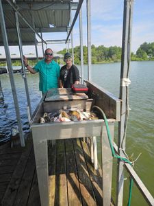 Two anglers enjoying fishing in TX