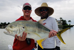 A Crevalle Jack fish caught by two people in Bonita Springs