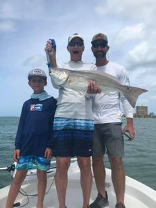 A group of 3 people fishing in FL