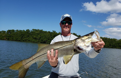 Photo of a large snook fish caught while fishing in FL