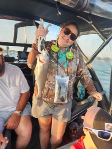 A lone angler fishing in Avon Lake