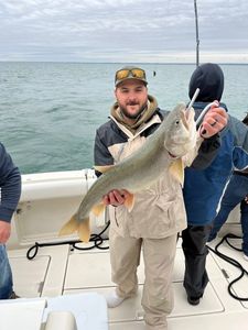 A person fishing at 990 Point Breeze Road with a big 21-inch fish