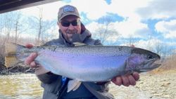 A rainbow trout, 33 inches long, caught while fishing in NY