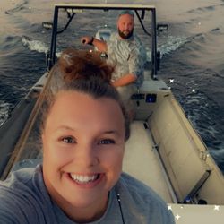 Two people fishing on the shore of Crystal River