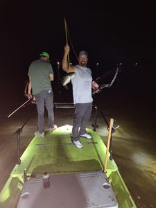 Angler holding a small fish in sunny Florida