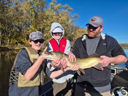 Three people fishing in Wisconsin Rapids