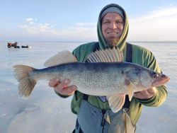 Angler holding a large walleye in Wisconsin Rapids