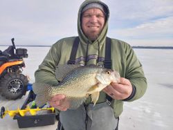 A fisherman catches a crappie fish in Wisconsin