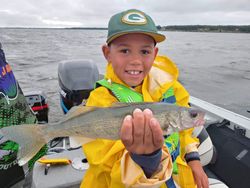 A fisherman holding a 21-inch fish in Wisconsin Rapids