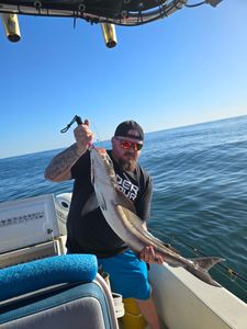 Angler catching a 24-inch fish in Sebastian