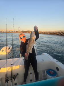 Reeling in the big one on a sunny day.