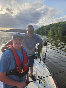 Successful bass fishing trip on lake in King George VA with freshly caught largemouth bass