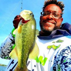 Angler catching a 13-inch fish while fishing in King George