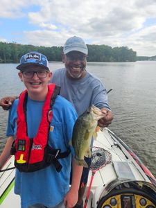Bass fishing success on lake in King George VA with freshly caught largemouth bass