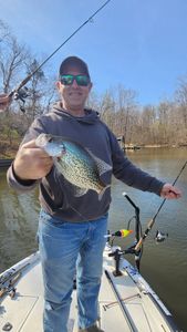 Freshly caught crappie held up on fishing boat in King George VA waters