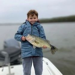 One fisherman holding a 17-inch fish in King George
