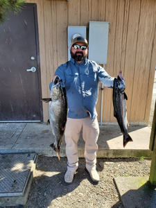 Angler catching 2 big fish in Oregon