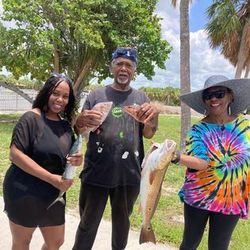 A group of 3 people fishing in FL