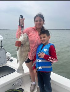 Corpus Christi fisherman with a black drum fish