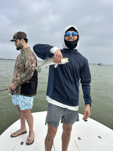 Enjoying the outdoors on the water with a catch.