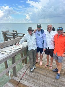 Four people fishing in Corpus Christi, Texas