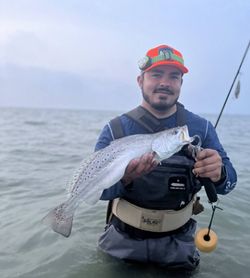 A person fishing for a spotted weakfish in Corpus Christi.