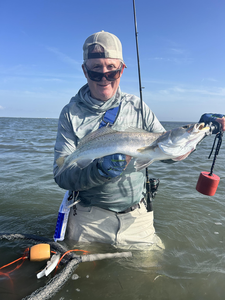 Jigging success: Spotted Weakfish reeled in on a partly cloudy day!