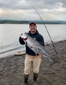 Angler holding a rainbow trout fish in Port Orchard