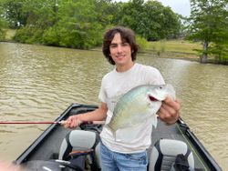 Angler holding large fish in Oxford