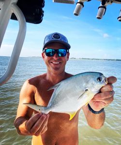 Photograph of a single Florida Pompano fish caught while fishing in SC.