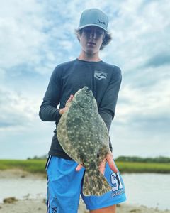 Photograph of a summer flounder measuring 19 inches, caught while fishing in South Carolina.