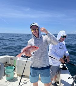 Two people fishing at Fernandina Beach