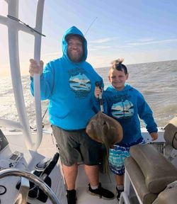 Two people fishing in Manteo
