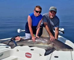 Impressive catch of a shark aboard the boat.