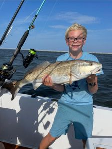 A fisherman in Wanchese, North Carolina, fishing and hunting for a big catch.