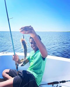 A person fishing in Wanchese