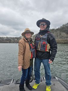 Two people standing in a scenic location in Branson