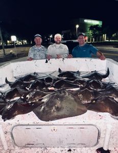Three anglers enjoying a day of fishing in Panama City Beach