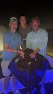 Three people enjoying a fishing trip in Panama City Beach