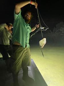 Angler posing with a 12-inch fish caught in Panama City Beach