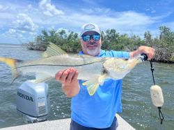 A person fishing for a snook in Placida
