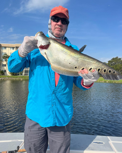 A lone angler fishing in the waters of Delray Beach, Florida