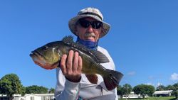 Angler with fishing rod catching a fish in Delray Beach