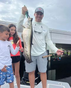Three people fishing at Delray Beach