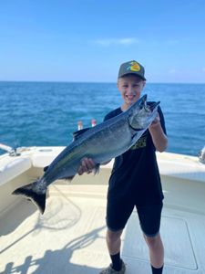 One fisherman reeling in a 28-inch catch in NY