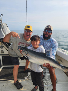 3 people fishing in Olcott with a 26-inch fish